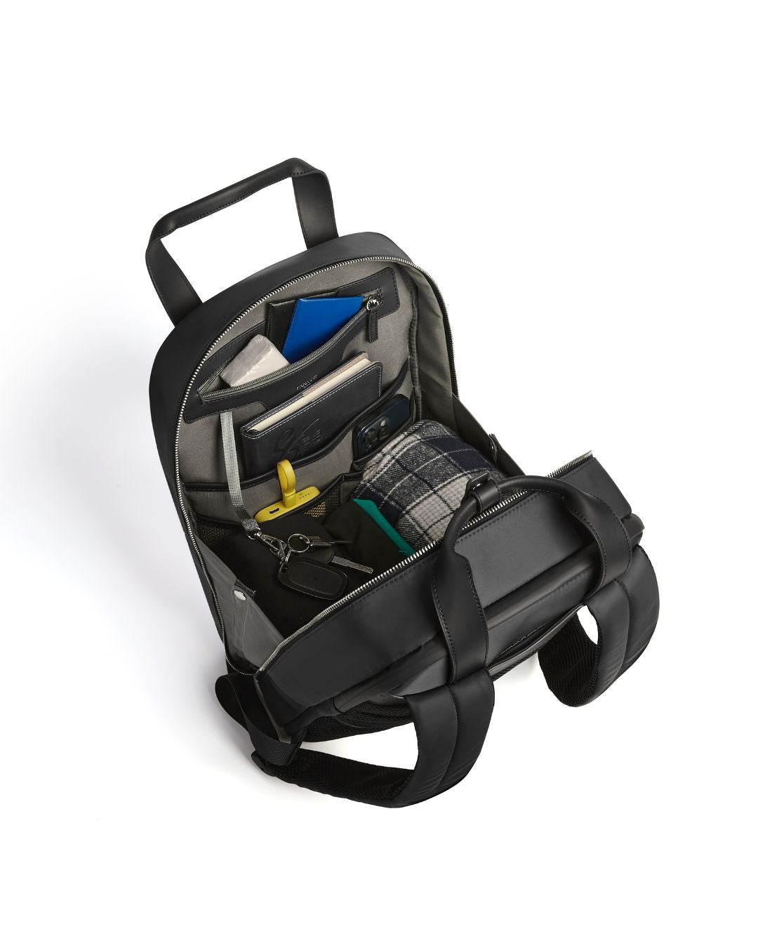 Black backpack with compartments on a white background